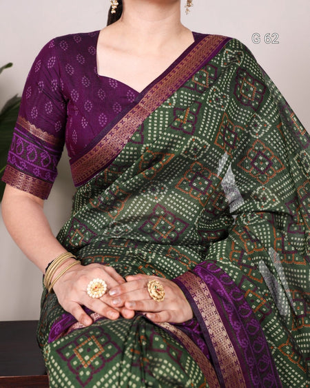 Woman wearing a green and purple patterned saree with gold jewelry.