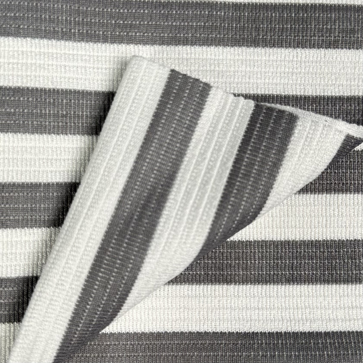 Textured fabric with black and white stripes