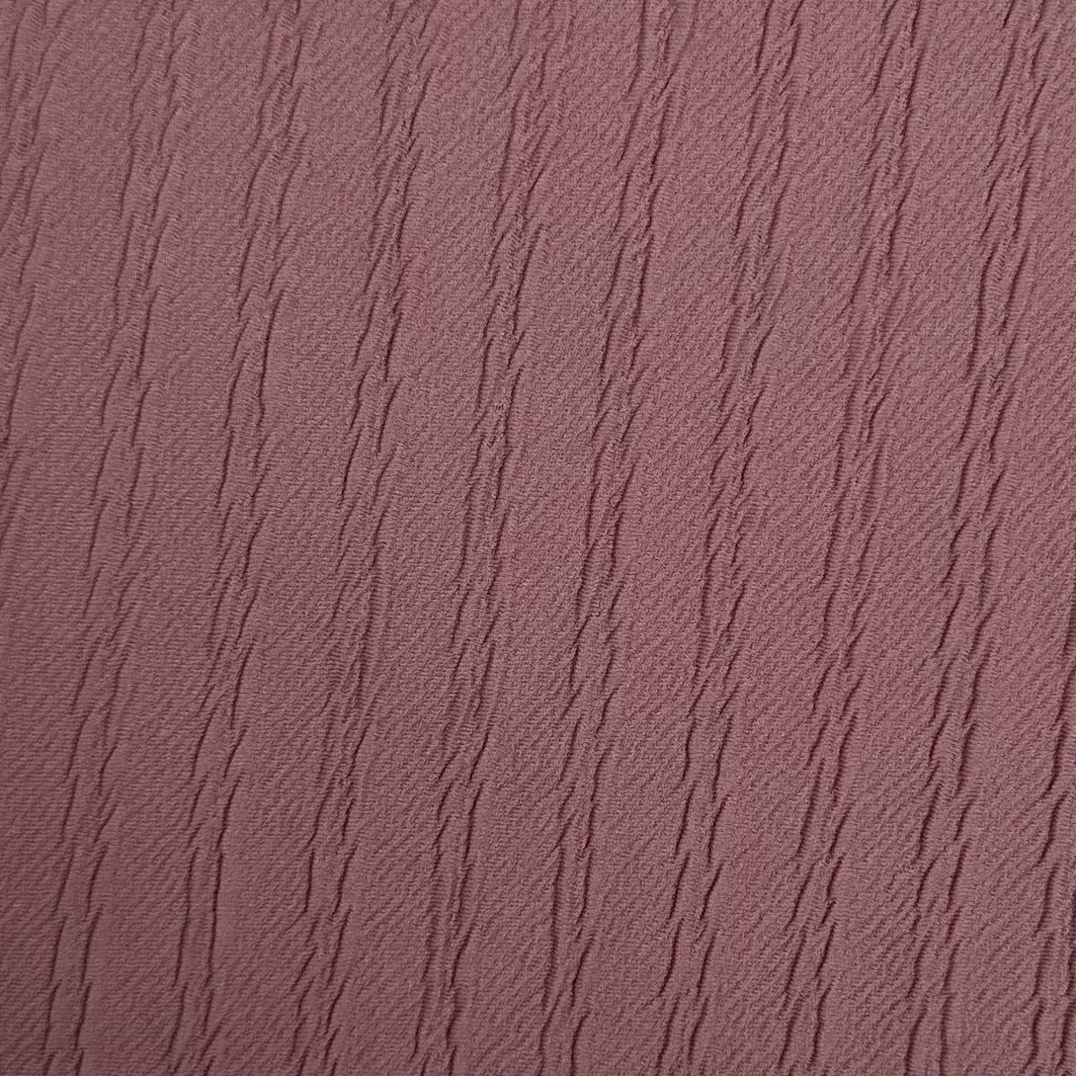 Textured purple fabric pattern