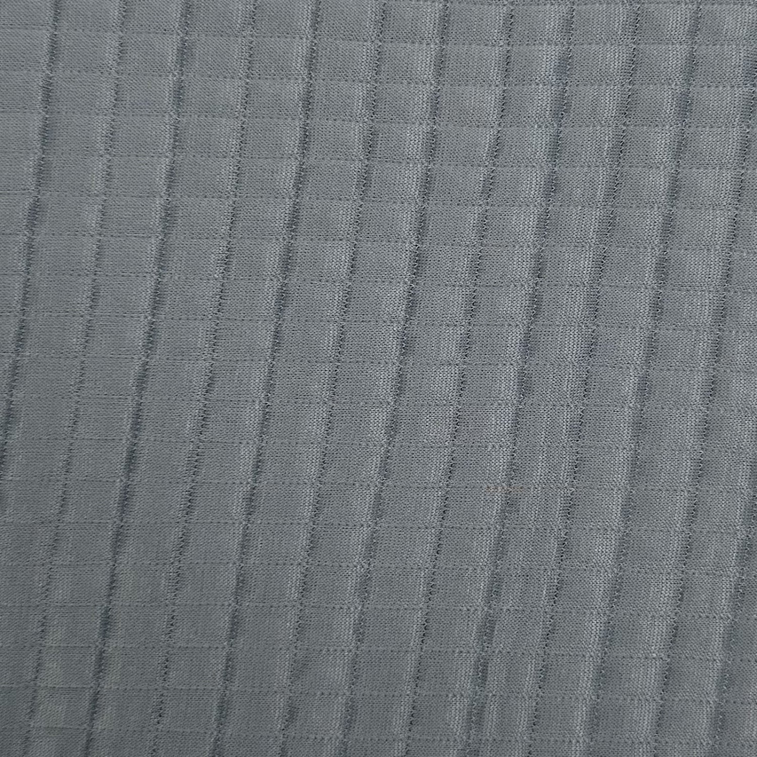 Close-up of textured gray fabric with a subtle pattern