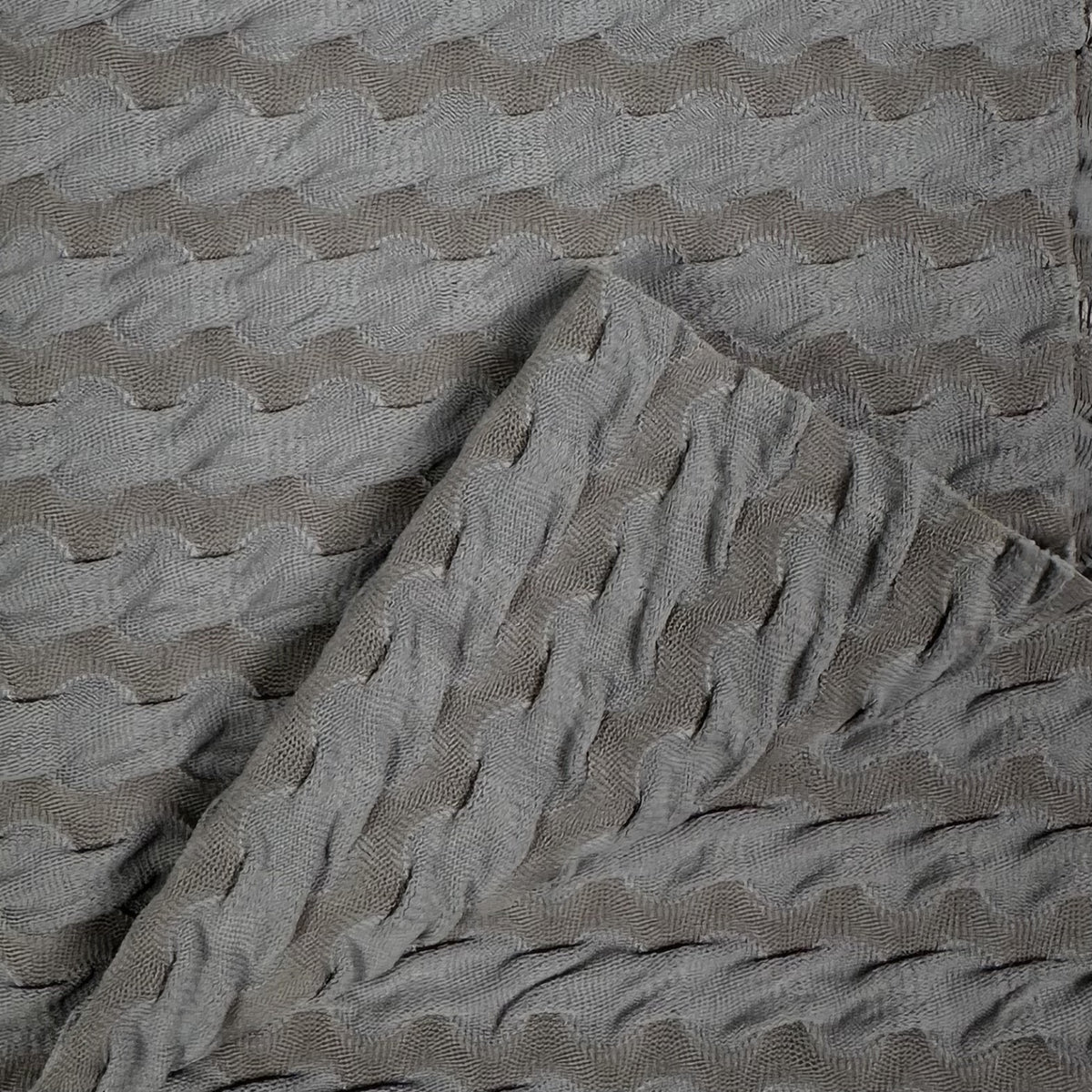 Textured gray fabric with wavy pattern