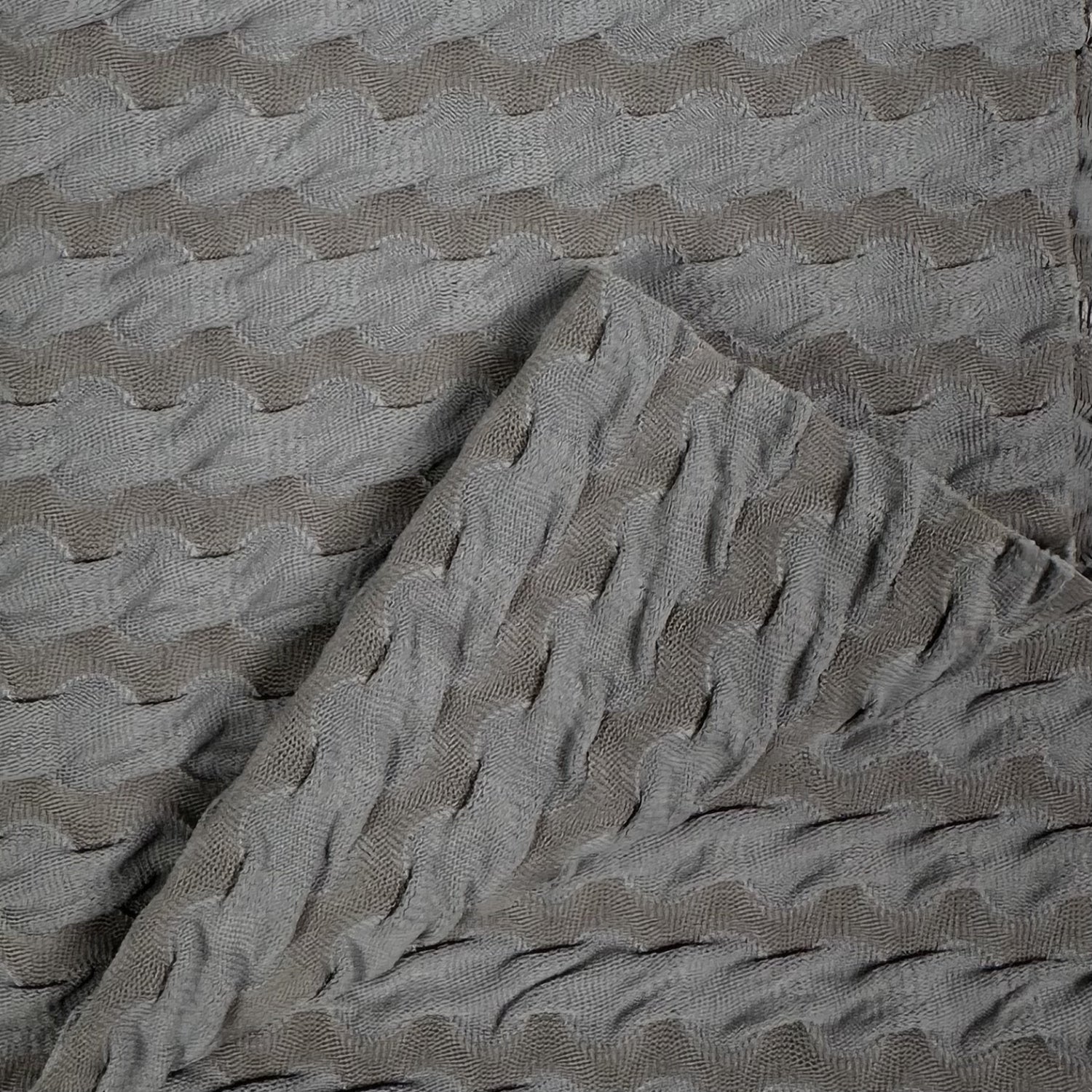 Textured gray fabric with wavy pattern