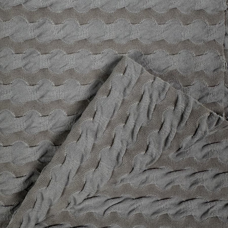 Textured gray fabric with wavy pattern