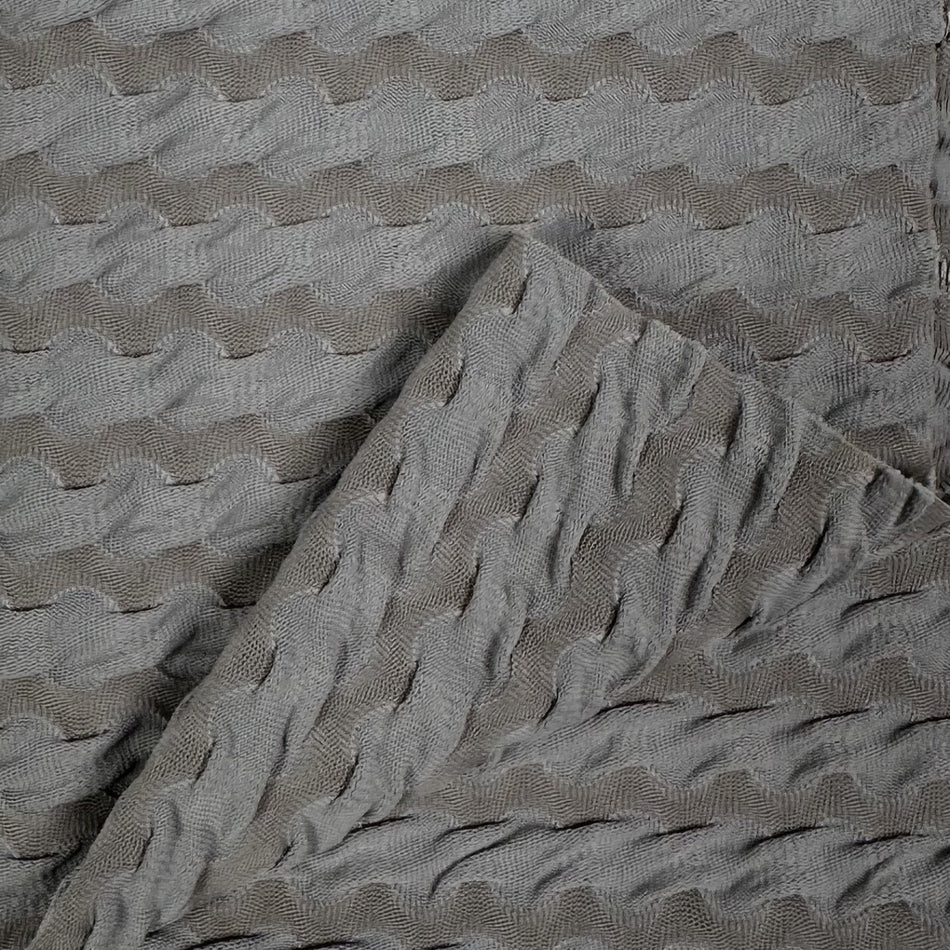 Textured gray fabric with wavy pattern