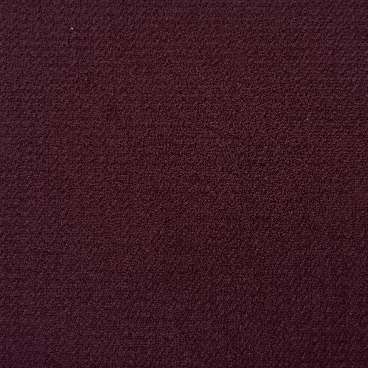 Solid burgundy color swatch with a textured pattern