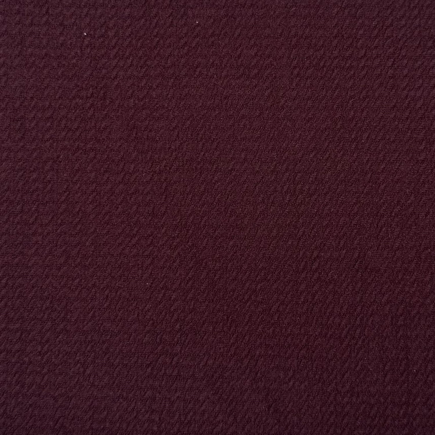 Solid burgundy color swatch with a textured pattern