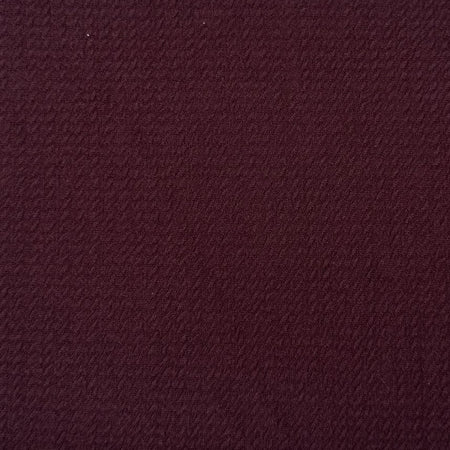 Solid burgundy color swatch with a textured pattern