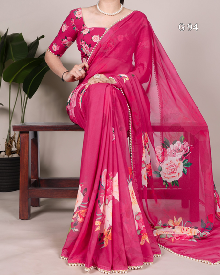 Pink saree with floral patterns on a neutral background