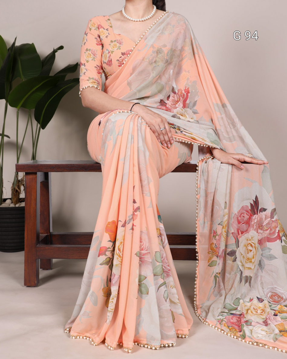 Woman wearing a floral saree with a light background