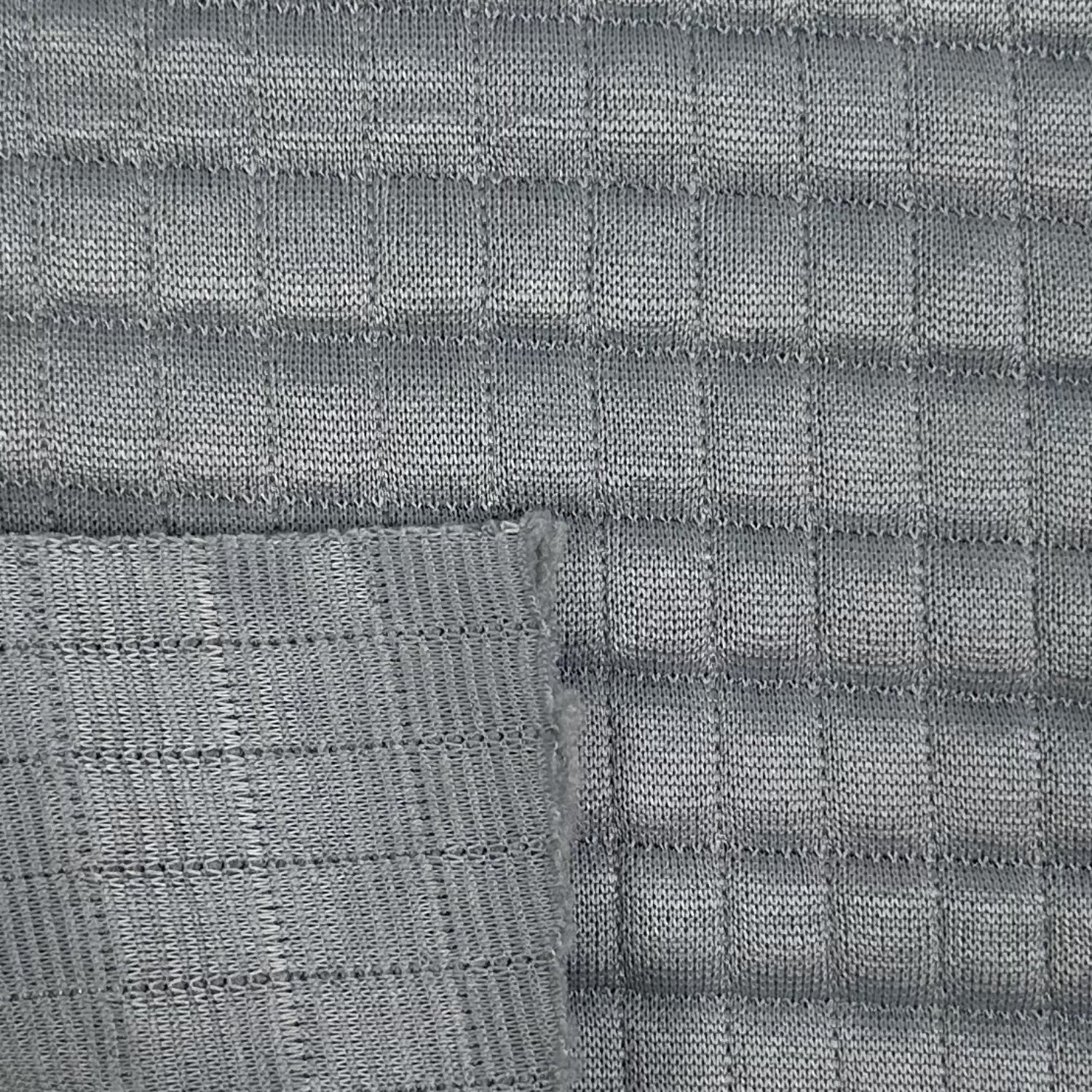 Close-up of gray woven fabric with a grid pattern