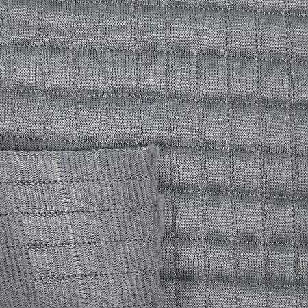 Close-up of gray woven fabric with a grid pattern