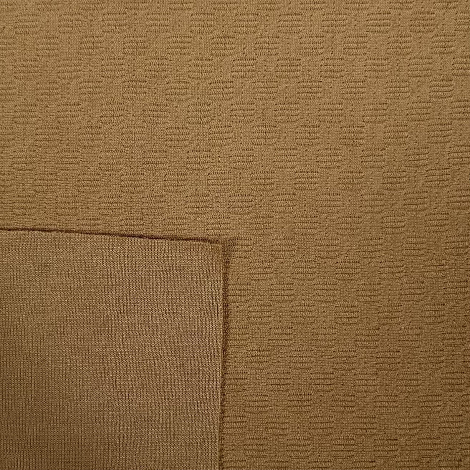 Close-up of brown textured fabric with a subtle pattern