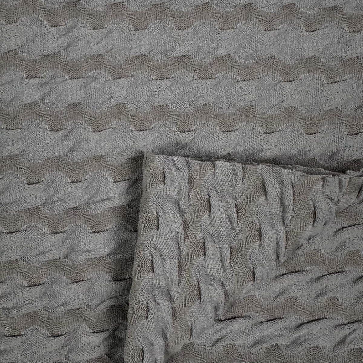 Textured gray fabric with wavy pattern