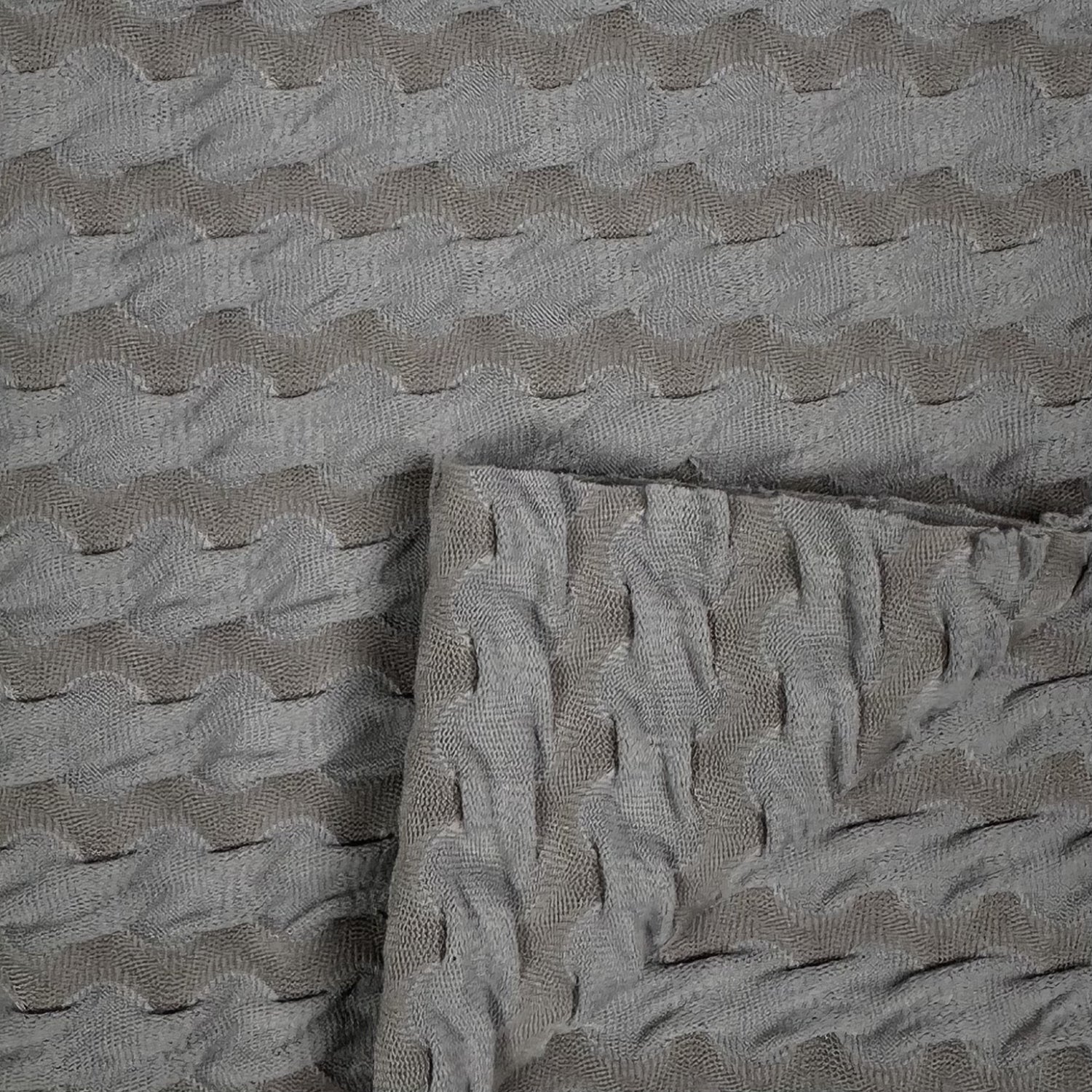 Textured gray fabric with wavy pattern