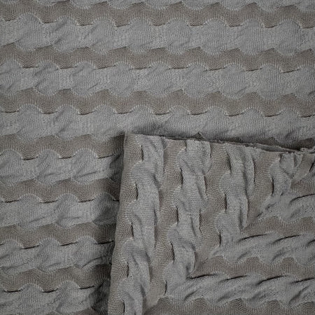 Textured gray fabric with wavy pattern
