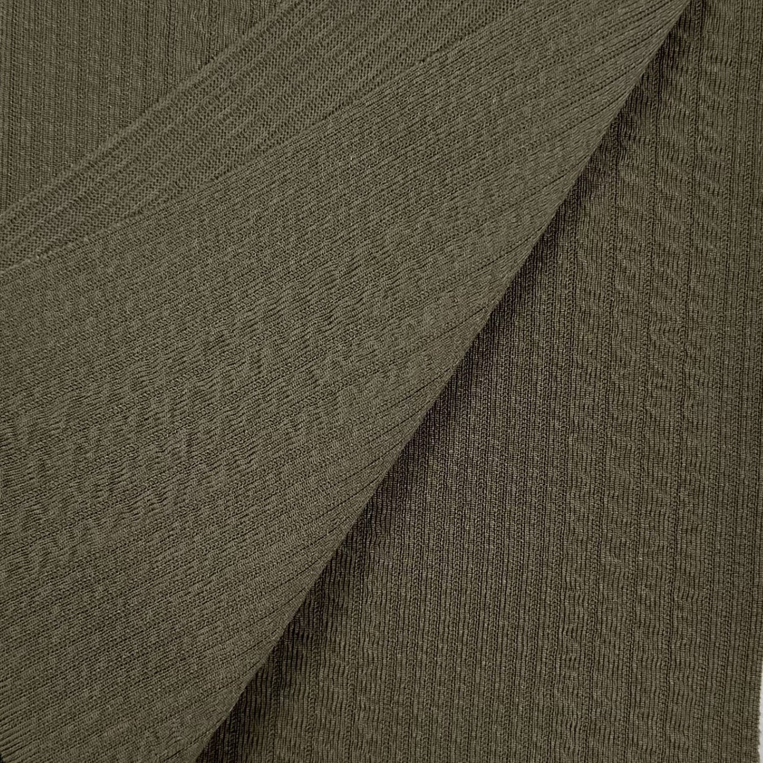 Close-up of textured brown fabric with a diagonal pattern