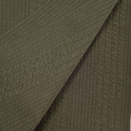 Close-up of textured brown fabric with a diagonal pattern