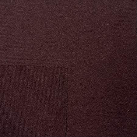 Close-up of brown fabric with a visible seam
