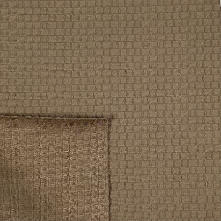 Close-up of brown textured fabric with a geometric pattern