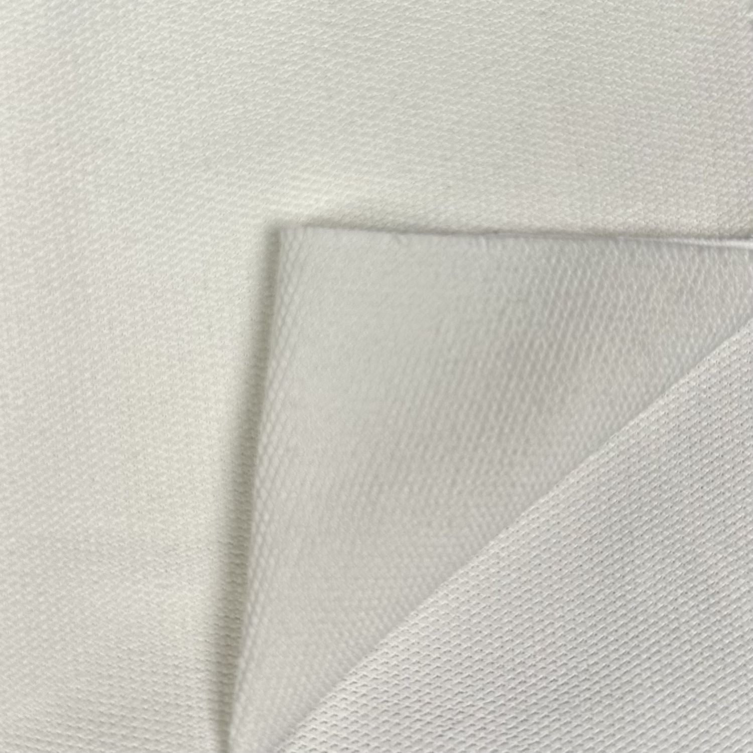 Close-up of textured light gray fabric on a matching background