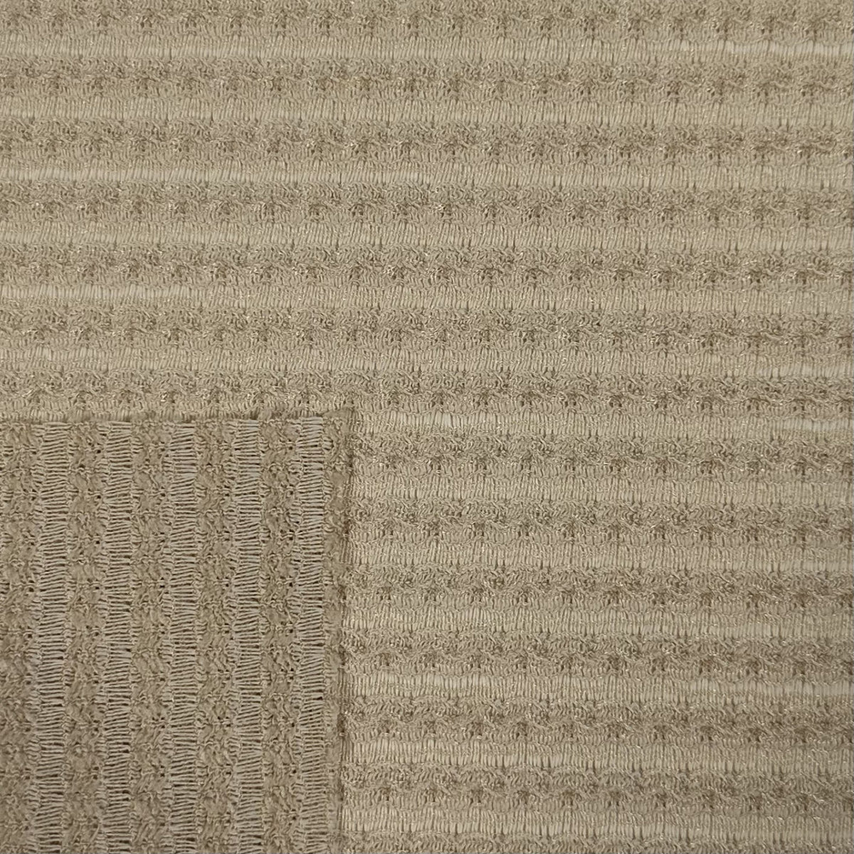 Textured beige carpet with a subtle pattern