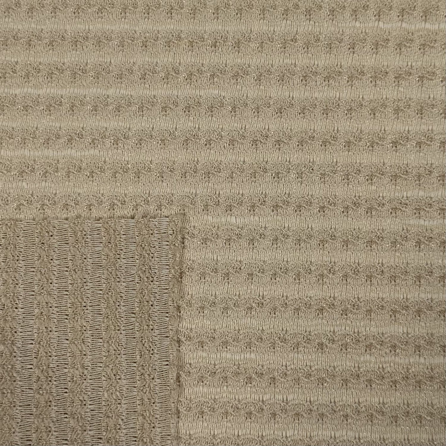 Textured beige carpet with a subtle pattern