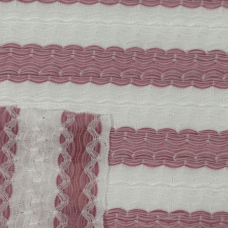Close-up of fabric with wavy red pattern on a white background