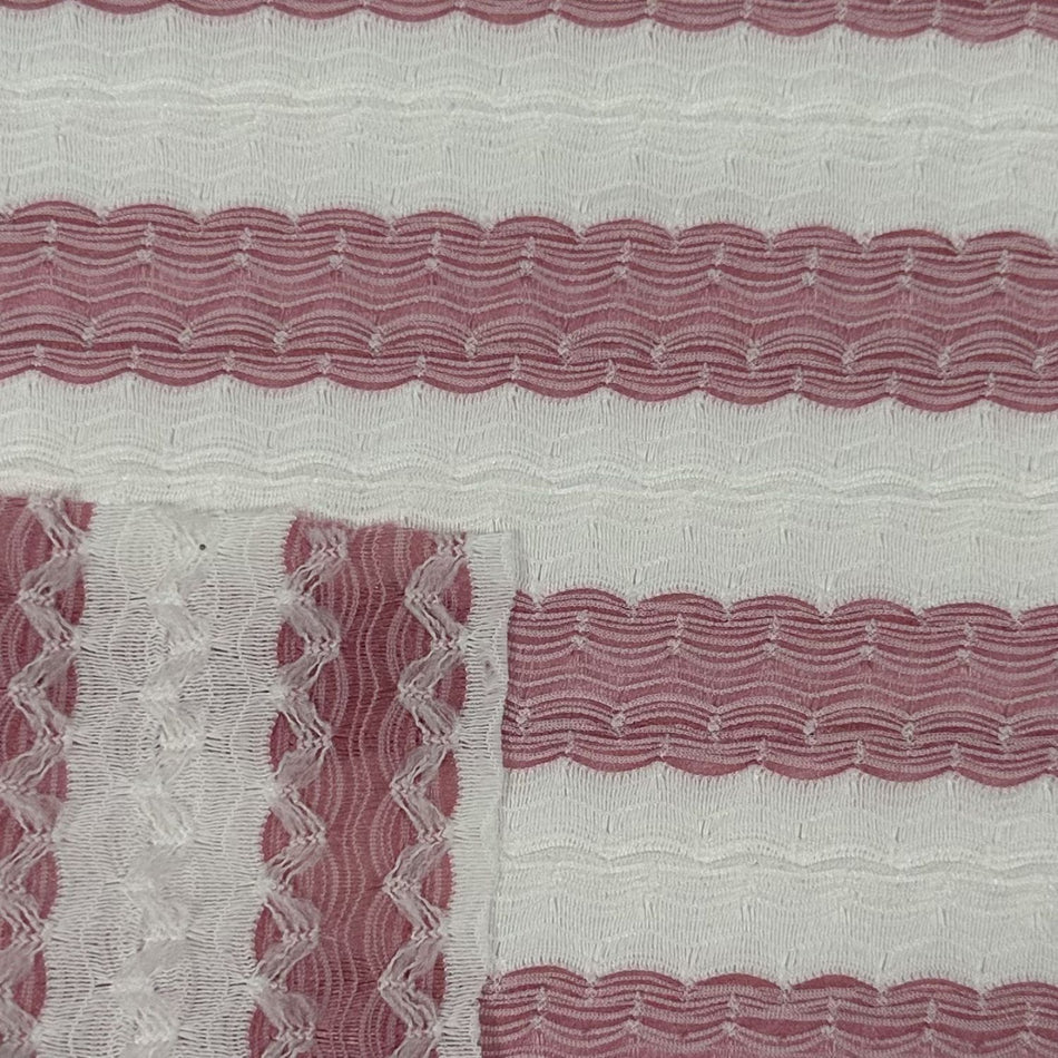 Close-up of fabric with wavy red pattern on a white background