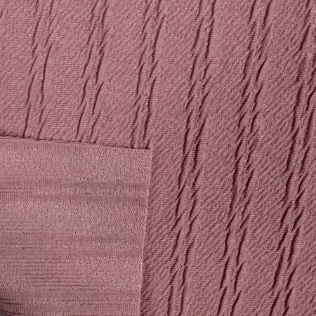 Close-up of textured pink fabric with diagonal lines