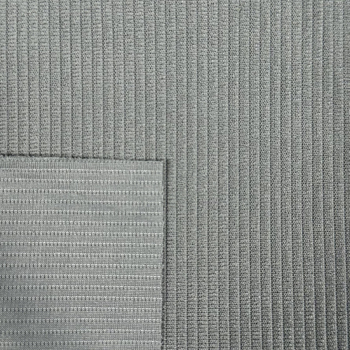 Close-up of textured gray fabric with a subtle pattern