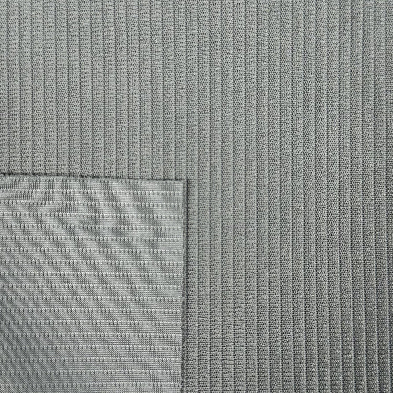 Close-up of textured gray fabric with a subtle pattern