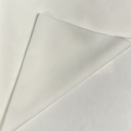 Close-up of a light gray fabric with a subtle texture on a white background