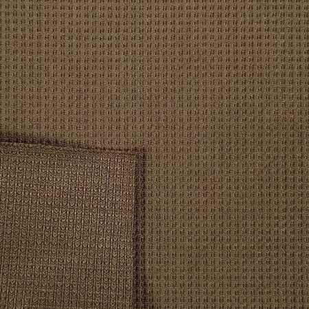 Close-up of brown textured fabric with a visible seam.