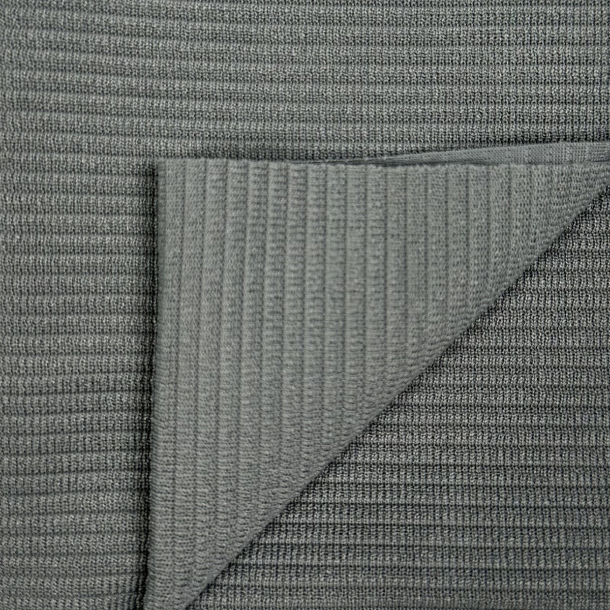 Close-up of textured gray fabric with diagonal pattern