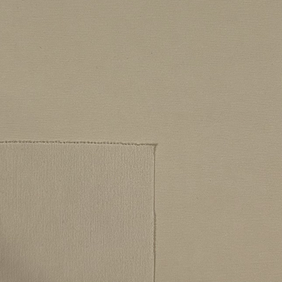 Beige fabric texture with a subtle pattern