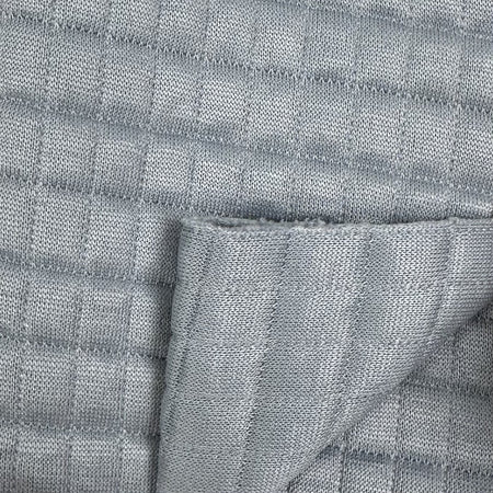 Close-up of textured gray fabric with a subtle pattern