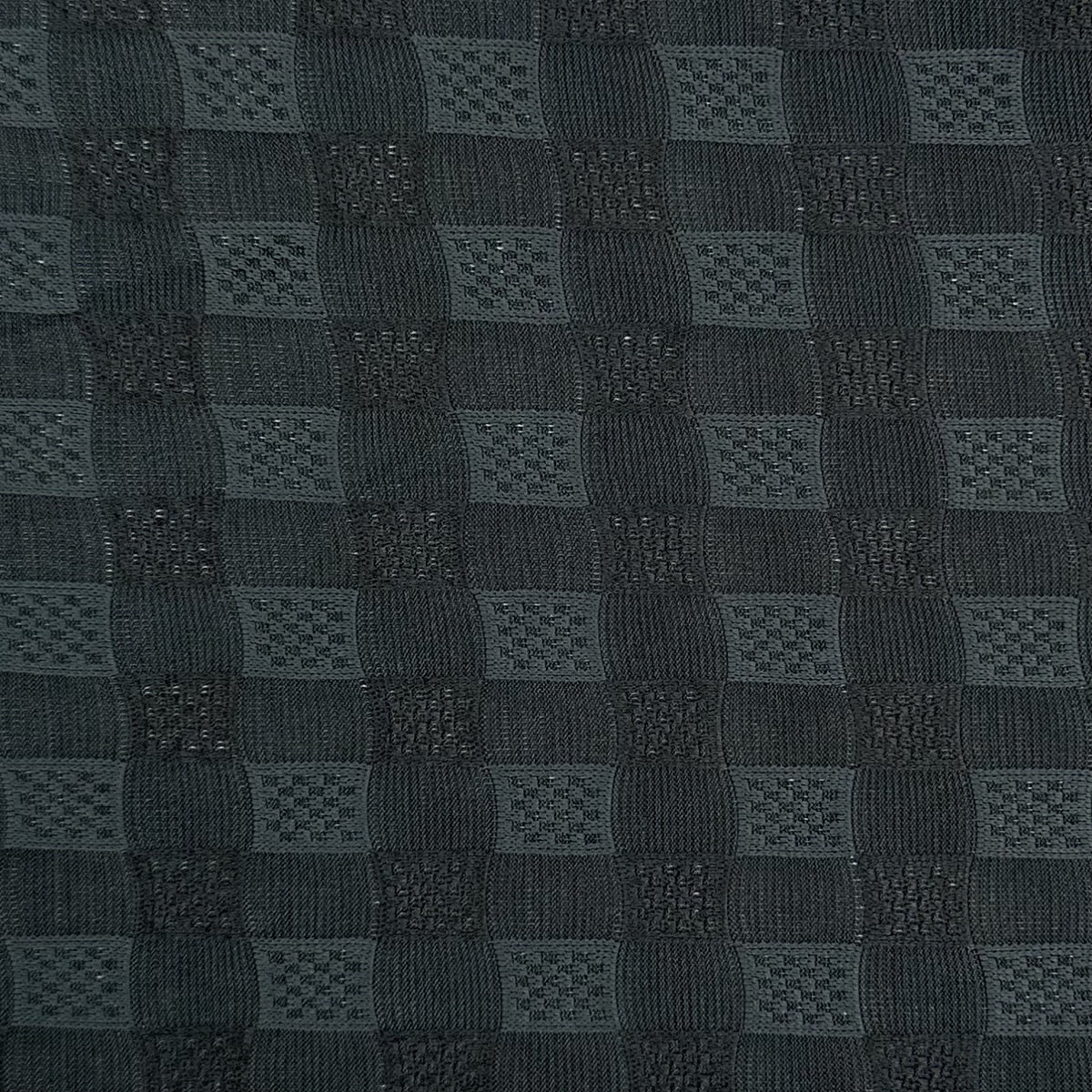 Dark gray textured fabric with a checkered pattern