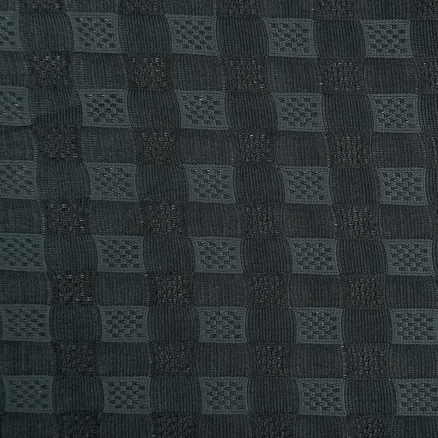 Dark gray textured fabric with a checkered pattern