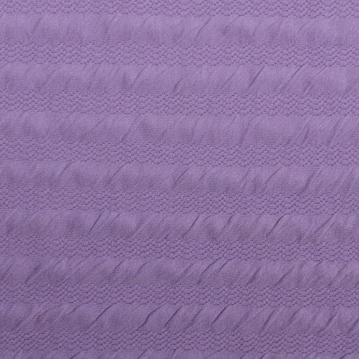 Close-up of textured purple fabric
