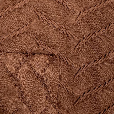 Close-up of brown textured fabric with a diamond pattern