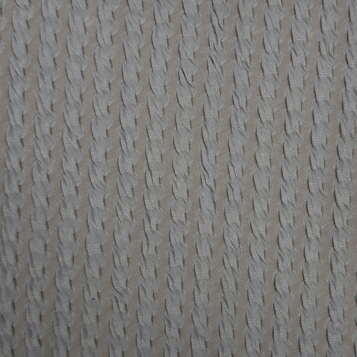 Textured beige fabric pattern