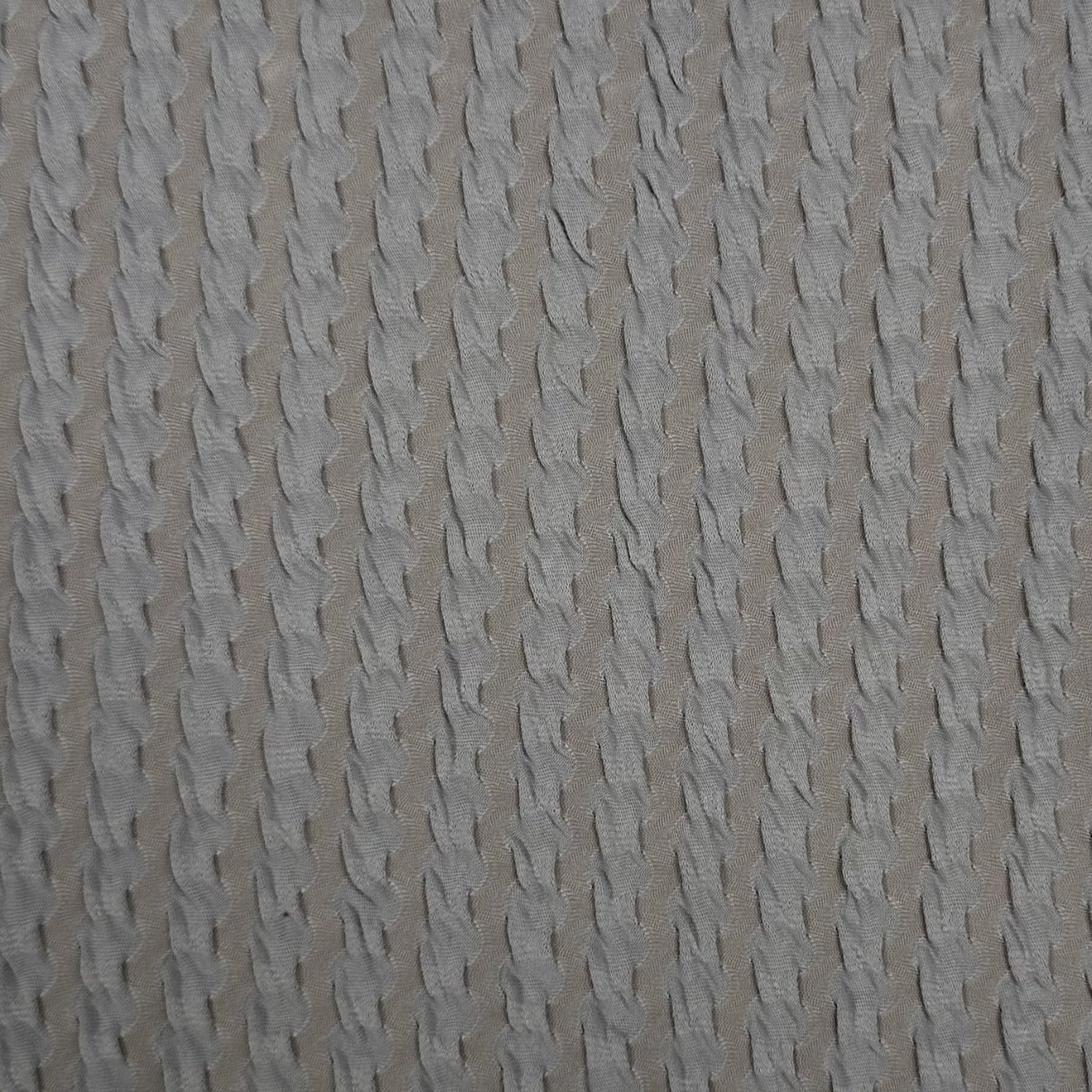 Textured beige fabric pattern