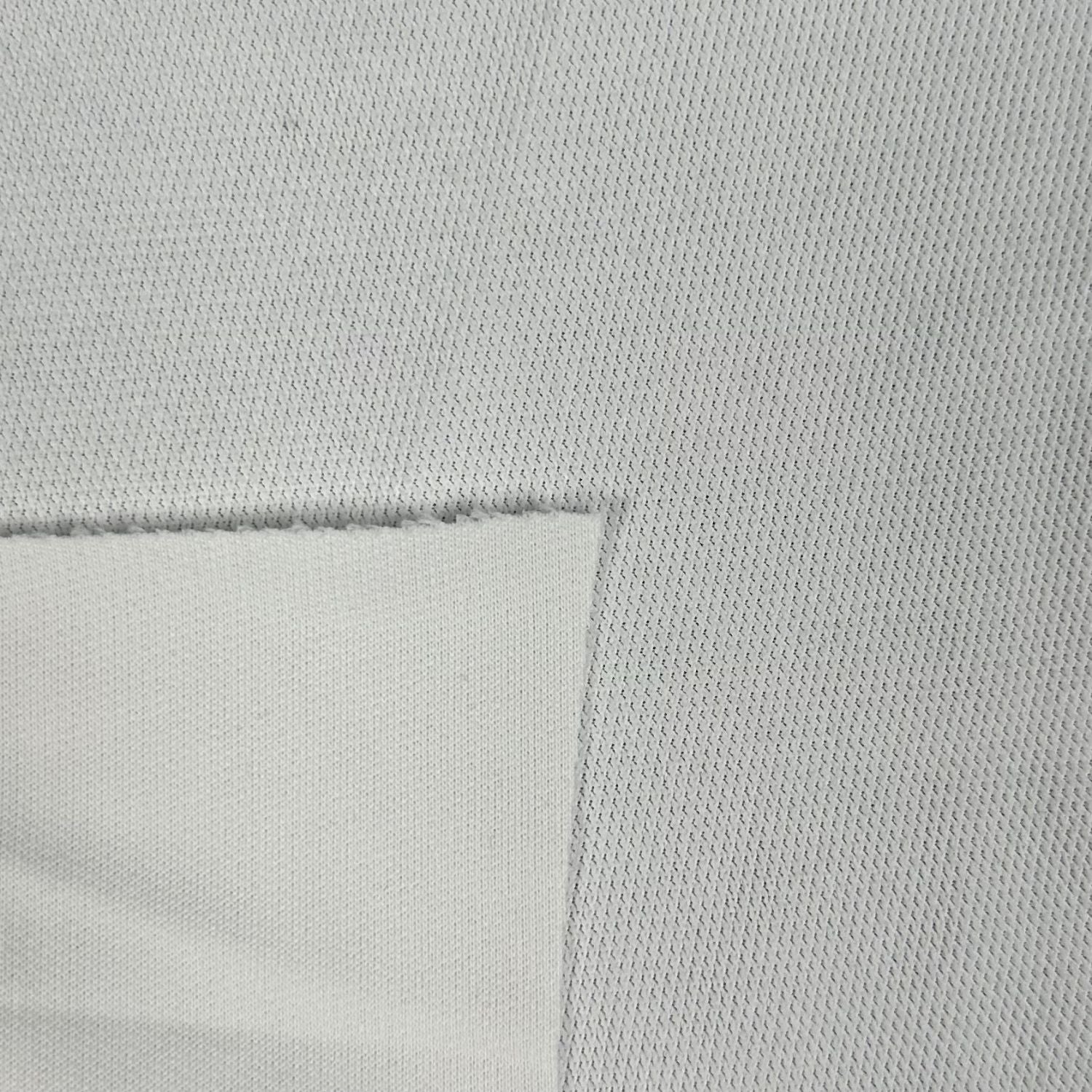 Close-up of a textured light gray fabric with a subtle pattern.