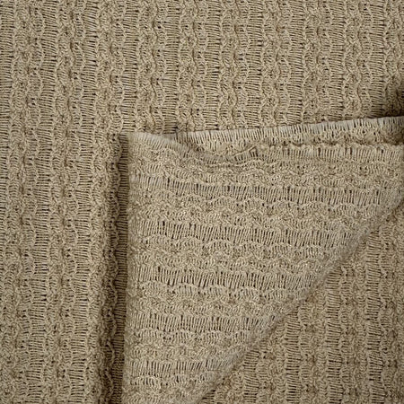 Close-up of beige textured fabric with a pocket detail