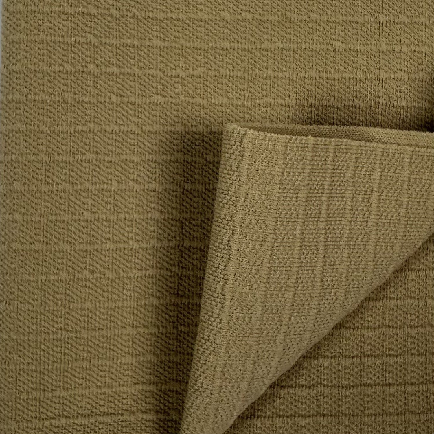 Close-up of brown textured fabric with a corner folded over