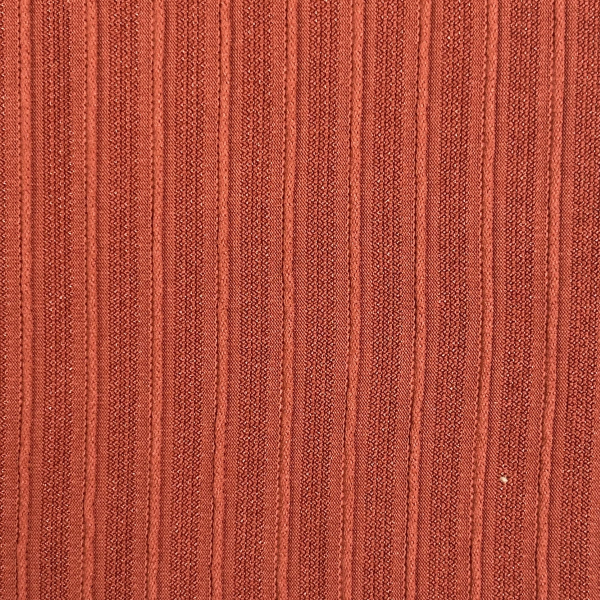 Close-up of a textured brown fabric surface