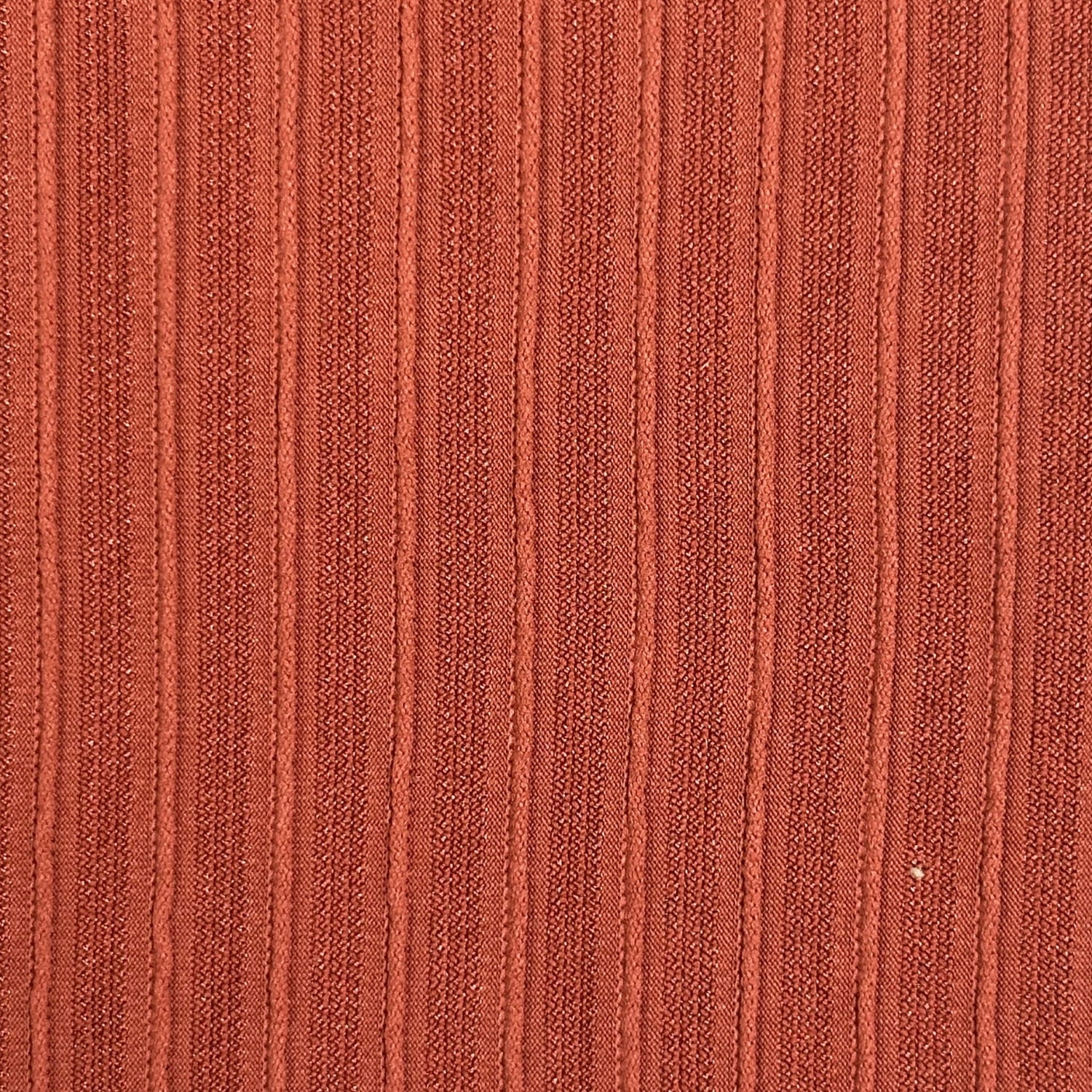 Close-up of a textured brown fabric surface