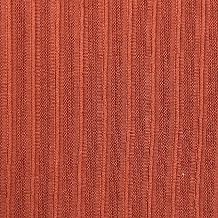 Close-up of a textured brown fabric surface