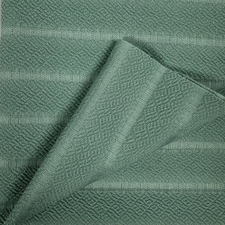 Close-up of green fabric with a textured pattern