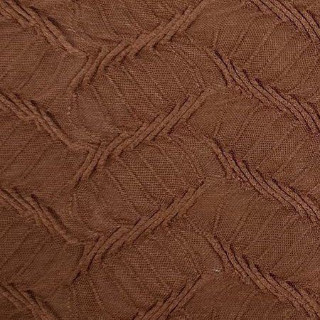 Close-up of brown textured fabric with a geometric pattern